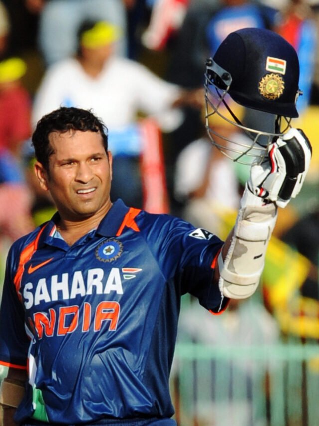 Indian batsman Sachin Tendulkar raises h