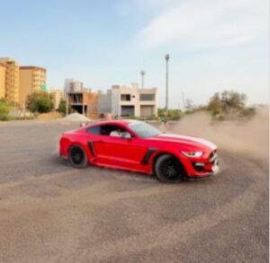 Elderly man drives Ford Mustang