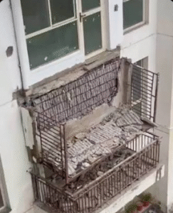Debris of a collapsed residential balcony inside a high-rise society complex in Gurugram representing construction quality issues.